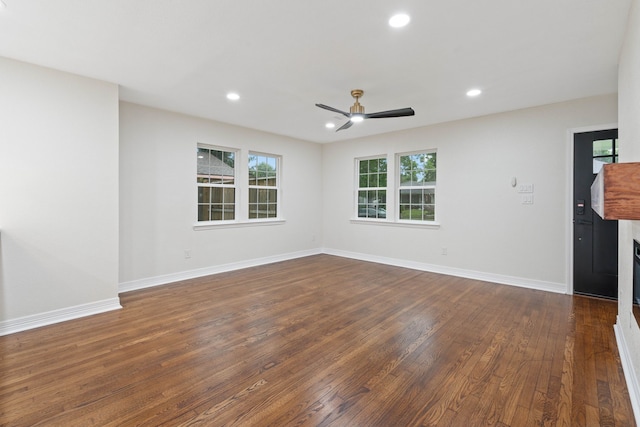 3734 Florinda St, Houston, TX 77021 - spare room featuring a ceiling fan, dark wood finished floors, recessed lighting, and a fireplace