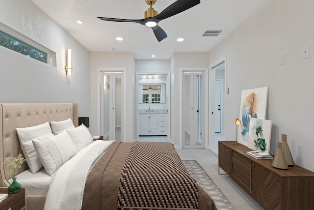 3734 Florinda St, Houston, TX 77021 - bedroom featuring light carpet, ensuite bath, a ceiling fan, and recessed lighting