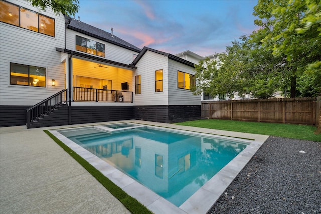 1917 Ebony Ln, Houston, TX 77018 - back of house featuring a pool with connected hot tub, stairway, and a patio area