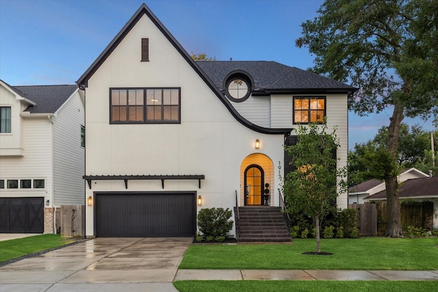 1917 Ebony Ln, Houston, TX 77018 - view of front facade with an attached garage, concrete driveway, and roof with shingles