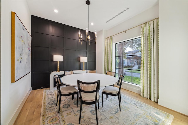 1917 Ebony Ln, Houston, TX 77018 - dining room with healthy amount of natural light, light wood finished floors, a chandelier, and recessed lighting