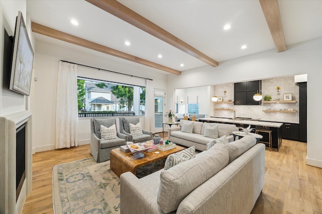 1917 Ebony Ln, Houston, TX 77018 - living room featuring beamed ceiling, recessed lighting, and light wood finished floors