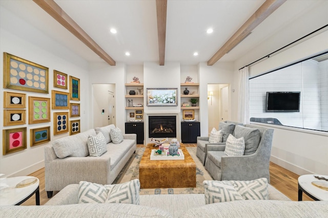1917 Ebony Ln, Houston, TX 77018 - living room with beam ceiling, light wood-type flooring, a glass covered fireplace, and recessed lighting