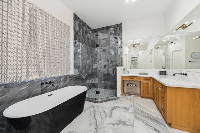 1917 Ebony Ln, Houston, TX 77018 - bathroom featuring a chandelier, a freestanding bath, a marble finish shower, vanity, and marble tiled flooring
