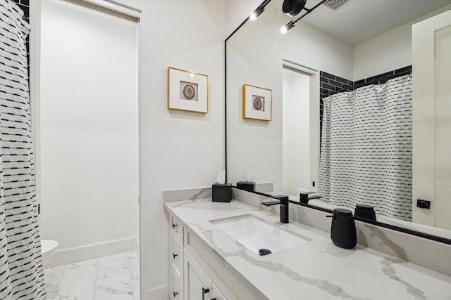 1917 Ebony Ln, Houston, TX 77018 - bathroom with marble look tiles, vanity, and curtained shower