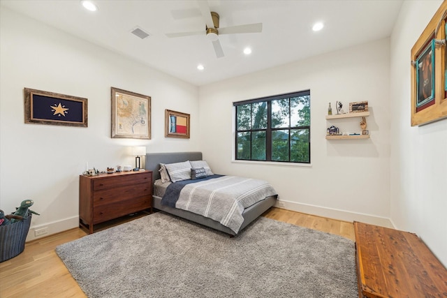 1917 Ebony Ln, Houston, TX 77018 - bedroom with light wood-style flooring, recessed lighting, and a ceiling fan