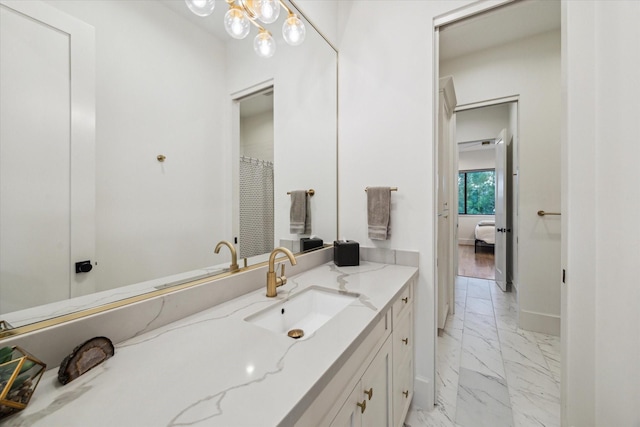 1917 Ebony Ln, Houston, TX 77018 - ensuite bathroom with marble finish floors, vanity, and a chandelier