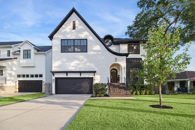 1917 Ebony Ln, Houston, TX 77018 - view of front of home with a garage, driveway, a front yard, a standing seam roof, and a metal roof