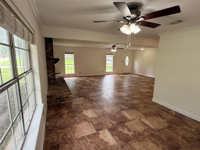 200 Wentworth Dr, West Columbia, TX 77486 - spare room featuring ceiling fan, baseboards, stone tile floors, and ornamental molding