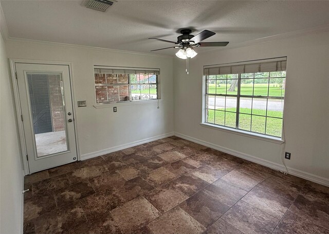 200 Wentworth Dr, West Columbia, TX 77486 - unfurnished room featuring baseboards, ornamental molding, a ceiling fan, stone finish floors, and a textured ceiling