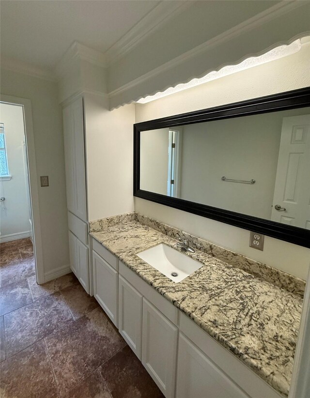 200 Wentworth Dr, West Columbia, TX 77486 - full bathroom with vanity, crown molding, baseboards, a shower, and stone finish floors