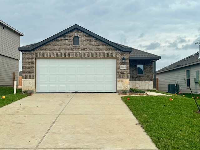 25565 Blossom Ct, Montgomery, TX 77316 - view of front facade featuring driveway, brick siding, stone siding, an attached garage, and a front lawn