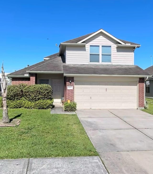 14534 Morningside View Dr, Houston, TX 77047 - view of front of home with brick siding, an attached garage, a front lawn, concrete driveway, and a shingled roof