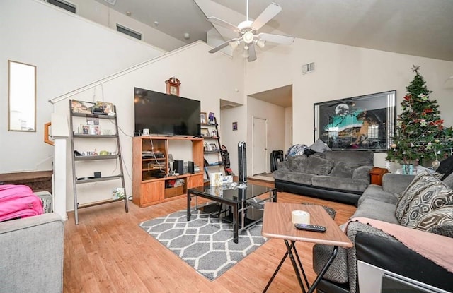14534 Morningside View Dr, Houston, TX 77047 - living area featuring wood finished floors, ceiling fan, and high vaulted ceiling