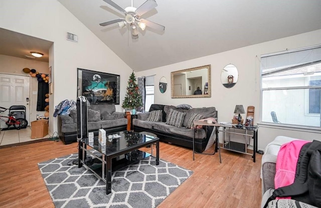14534 Morningside View Dr, Houston, TX 77047 - living area featuring ceiling fan, light wood-style floors, and high vaulted ceiling