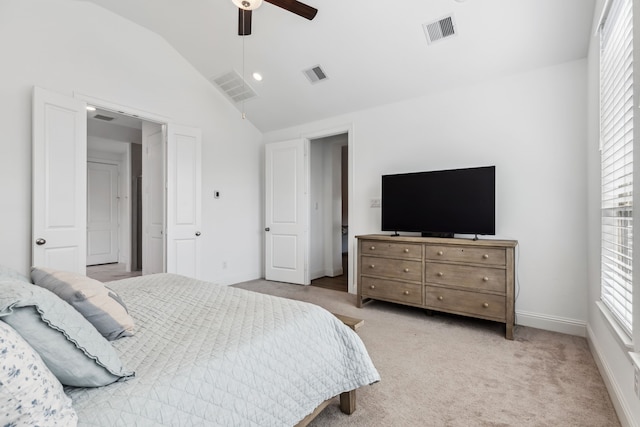 15003 Big Spring Park Dr, Cypress, TX 77433 - bedroom with multiple windows, vaulted ceiling, a ceiling fan, and light colored carpet
