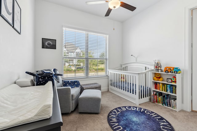 15003 Big Spring Park Dr, Cypress, TX 77433 - bedroom featuring carpet floors, a crib, and ceiling fan