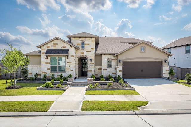 15003 Big Spring Park Dr, Cypress, TX 77433 - french country home with stone siding, concrete driveway, a shingled roof, an attached garage, and stucco siding