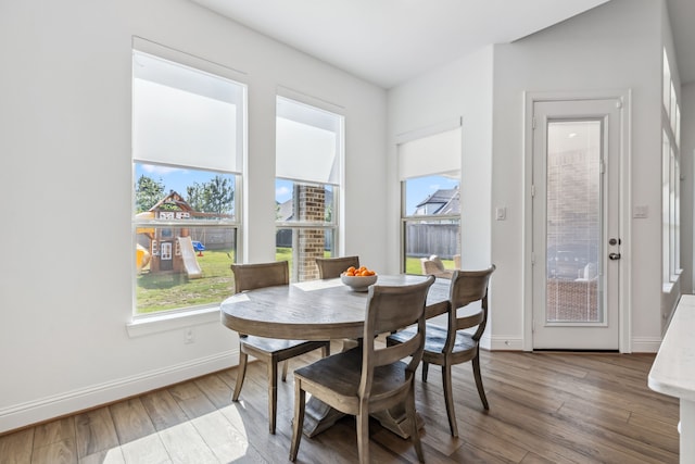 15003 Big Spring Park Dr, Cypress, TX 77433 - dining space featuring healthy amount of natural light and hardwood / wood-style floors