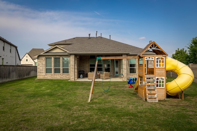 15003 Big Spring Park Dr, Cypress, TX 77433 - rear view of property with a playground, brick siding, a patio, and a shingled roof