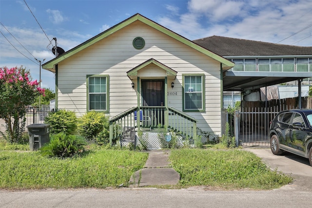 2604 Tuam St, Houston, TX 77004 - view of front of house with an attached carport