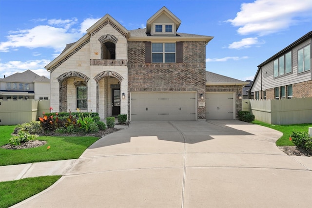 17040 Shy Leaf Ct, Conroe, TX 77385 - view of front facade featuring brick siding, concrete driveway, stone siding, roof with shingles, and an attached garage