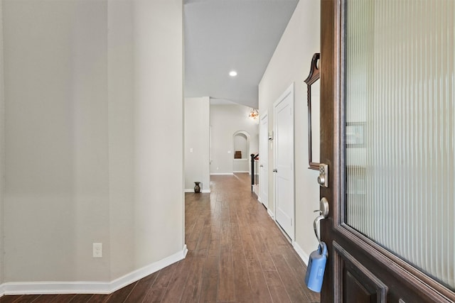 17040 Shy Leaf Ct, Conroe, TX 77385 - hallway featuring dark wood-type flooring, baseboards, recessed lighting, and arched walkways