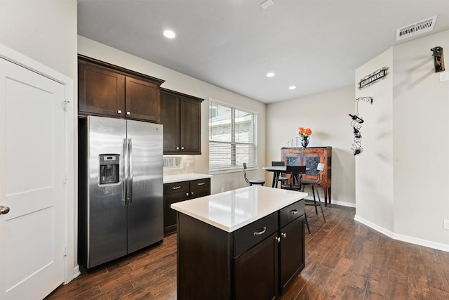 17040 Shy Leaf Ct, Conroe, TX 77385 - kitchen with stainless steel refrigerator with ice dispenser, light countertops, dark wood-type flooring, baseboards, and recessed lighting