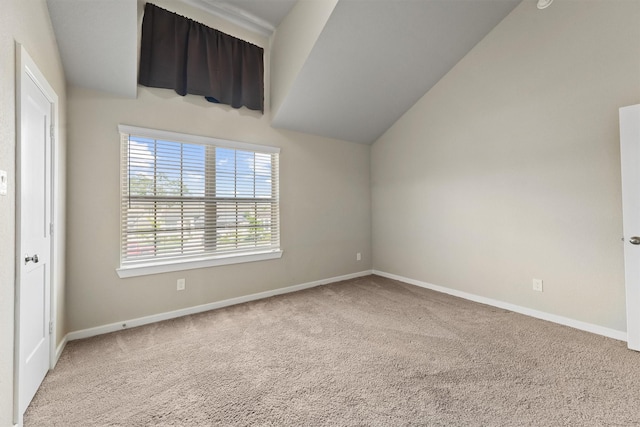 17040 Shy Leaf Ct, Conroe, TX 77385 - unfurnished bedroom with carpet floors, baseboards, and vaulted ceiling