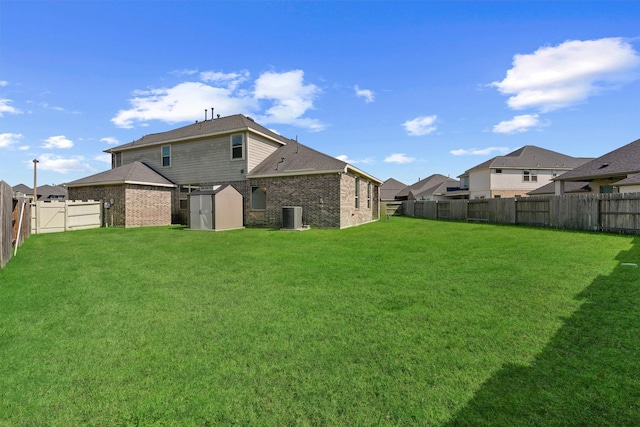 17040 Shy Leaf Ct, Conroe, TX 77385 - rear view of property featuring central AC unit, brick siding, and a residential view