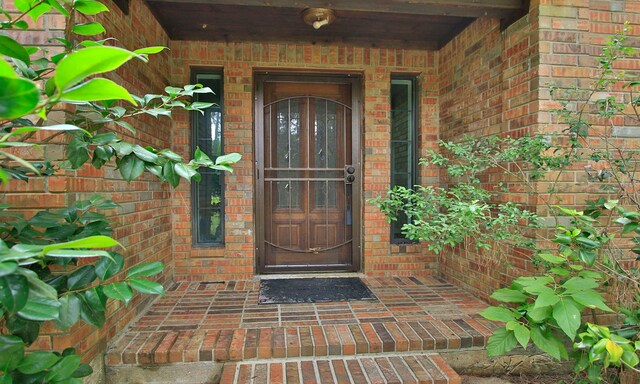 22402 Timber Ridge Dr, Magnolia, TX 77355 - property entrance featuring brick siding and covered porch