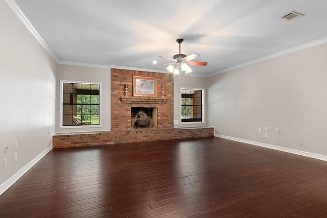 22402 Timber Ridge Dr, Magnolia, TX 77355 - unfurnished living room featuring ceiling fan, dark wood-style flooring, baseboards, ornamental molding, and a brick fireplace
