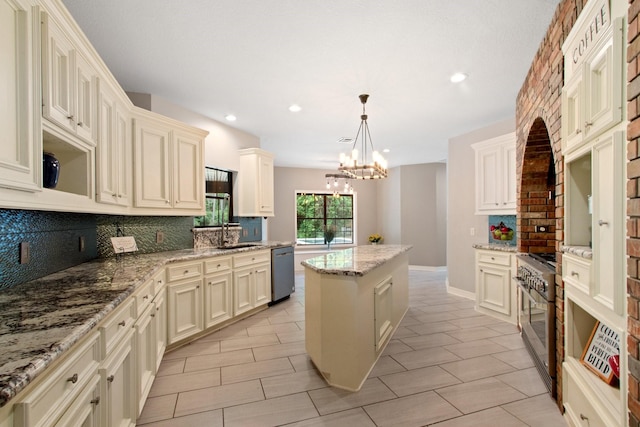 22402 Timber Ridge Dr, Magnolia, TX 77355 - kitchen with stainless steel appliances, backsplash, a kitchen island, a chandelier, and recessed lighting