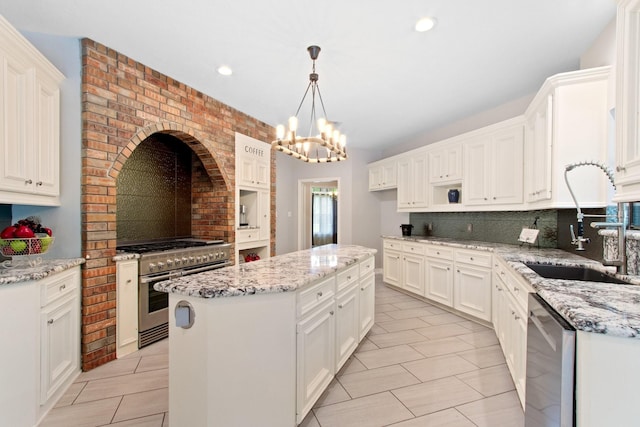22402 Timber Ridge Dr, Magnolia, TX 77355 - kitchen featuring stainless steel appliances, a sink, decorative backsplash, light tile patterned floors, and recessed lighting