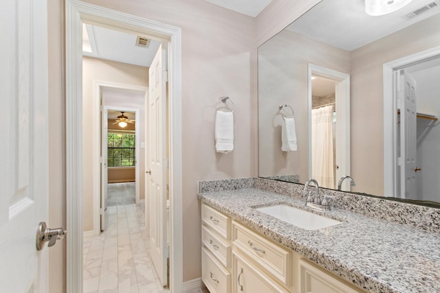 22402 Timber Ridge Dr, Magnolia, TX 77355 - bathroom featuring marble finish floors, vanity, and baseboards