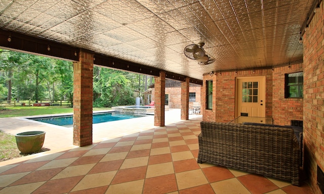 22402 Timber Ridge Dr, Magnolia, TX 77355 - view of patio / terrace with a pool with connected hot tub
