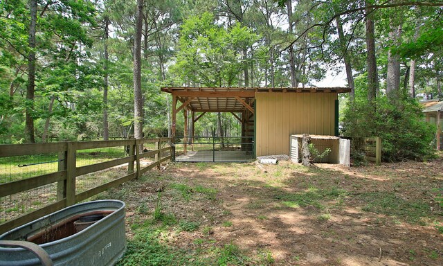 22402 Timber Ridge Dr, Magnolia, TX 77355 - view of yard featuring an outdoor structure and a pole building