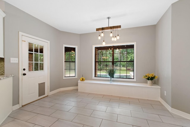 22402 Timber Ridge Dr, Magnolia, TX 77355 - unfurnished dining area featuring a chandelier, baseboards, and light tile patterned flooring