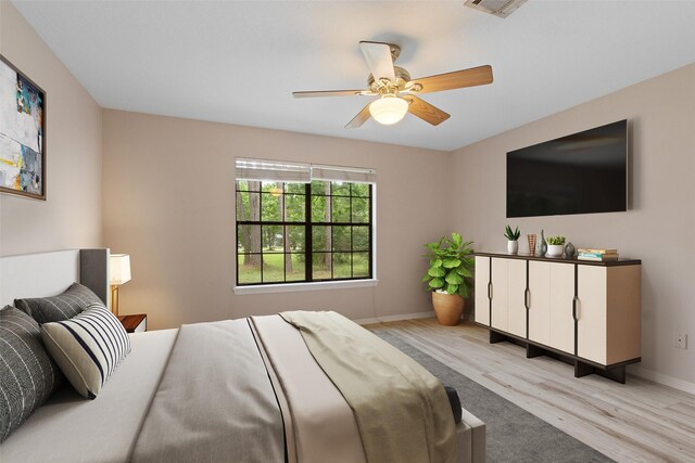 22402 Timber Ridge Dr, Magnolia, TX 77355 - bedroom featuring light wood-style floors, baseboards, and a ceiling fan