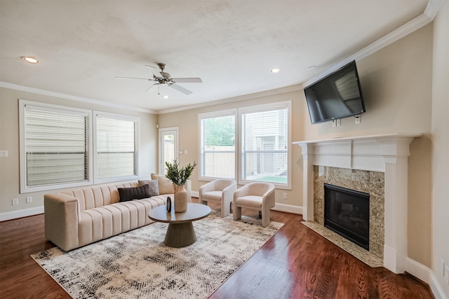 231 W 26th St, Houston, TX 77008 - living room featuring ornamental molding, a ceiling fan, baseboards, a premium fireplace, and wood finished floors