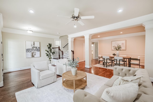 231 W 26th St, Houston, TX 77008 - living area featuring decorative columns, crown molding, wood finished floors, a ceiling fan, and stairs