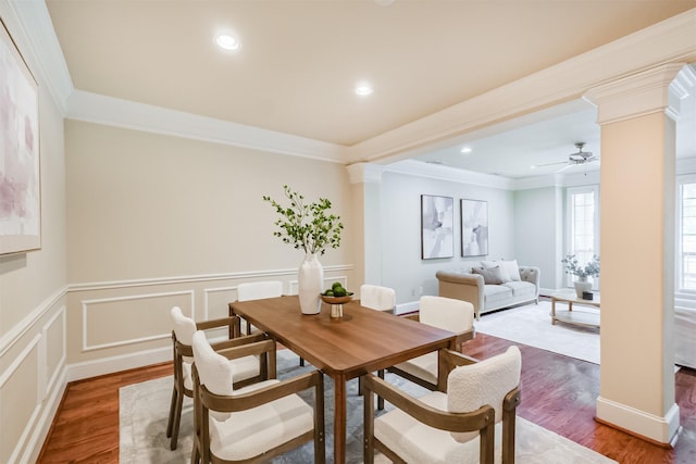 231 W 26th St, Houston, TX 77008 - dining room featuring decorative columns, wood finished floors, crown molding, a wainscoted wall, and recessed lighting