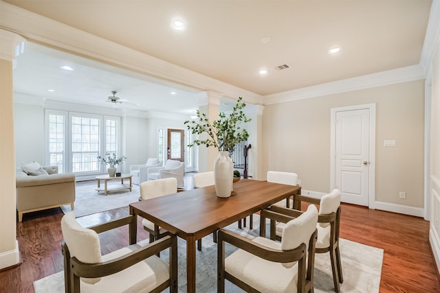 231 W 26th St, Houston, TX 77008 - dining space with ornate columns, crown molding, healthy amount of natural light, baseboards, and light wood-type flooring