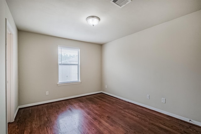 231 W 26th St, Houston, TX 77008 - unfurnished room with dark wood finished floors and baseboards