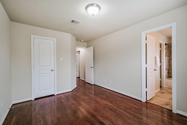 231 W 26th St, Houston, TX 77008 - unfurnished bedroom with wood finished floors and baseboards