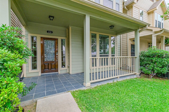 231 W 26th St, Houston, TX 77008 - view of exterior entry with covered porch and a yard