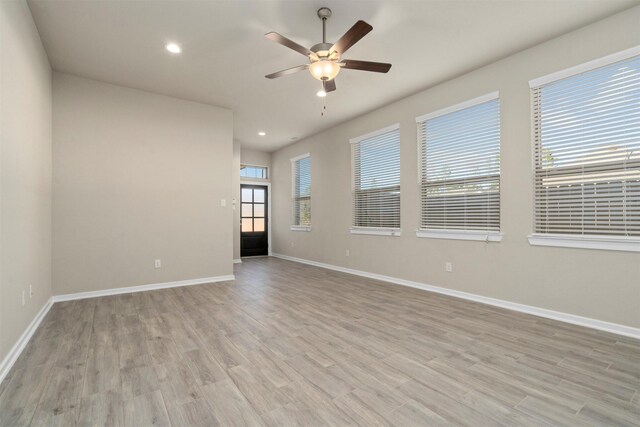 119 Lukewood Cir, Conroe, TX 77318 - spare room with a ceiling fan, recessed lighting, baseboards, and light wood-style flooring