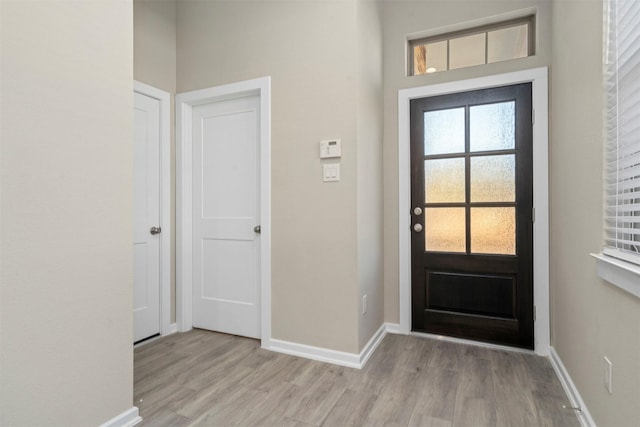 119 Lukewood Cir, Conroe, TX 77318 - foyer entrance featuring wood finished floors and baseboards