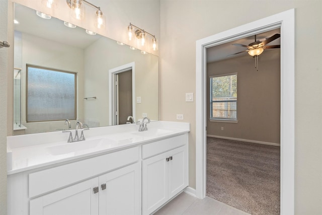 119 Lukewood Cir, Conroe, TX 77318 - full bath with double vanity, a ceiling fan, tile patterned floors, and baseboards