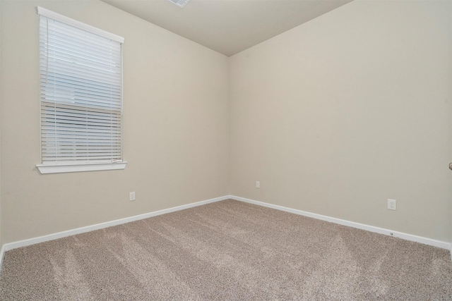 119 Lukewood Cir, Conroe, TX 77318 - spare room featuring carpet and baseboards